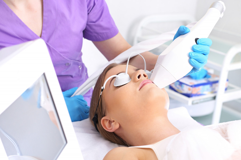 A woman getting laser cosmetic surgery