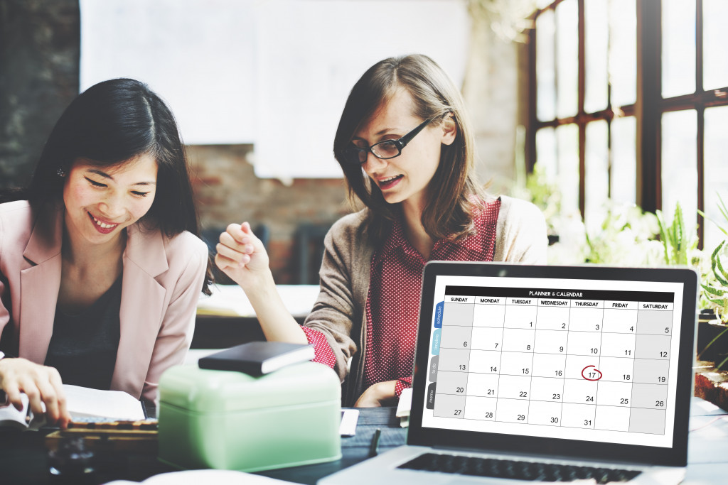 2 female business owners talking